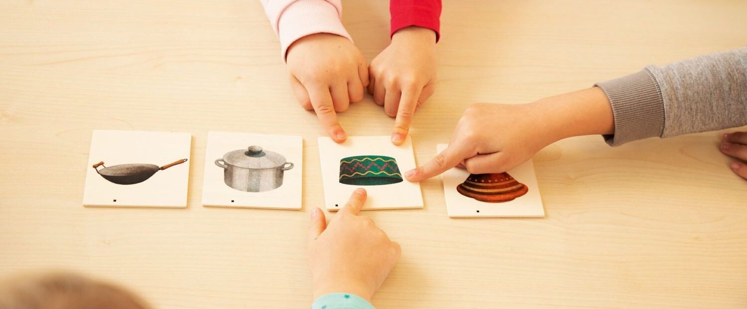 Children expanding vocabulary through interactive language development activities.