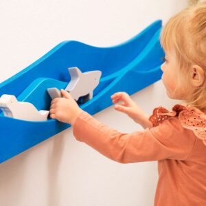 Interactive wall play with figures designed to enhance spatial reasoning and problem-solving.